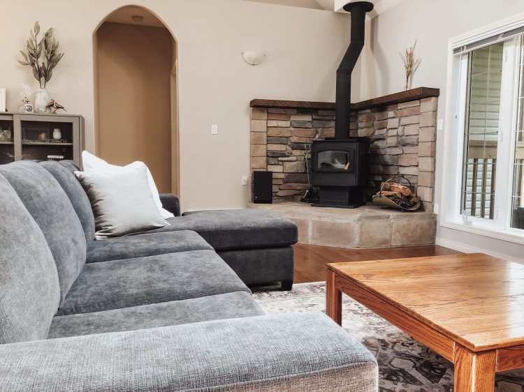 Cottage rental with fireplace in the living room.