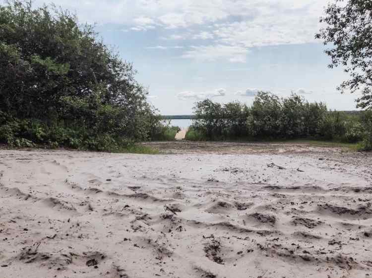A sandy corner as you approach the dock, at Lakeview Cottage at North Buck Lake